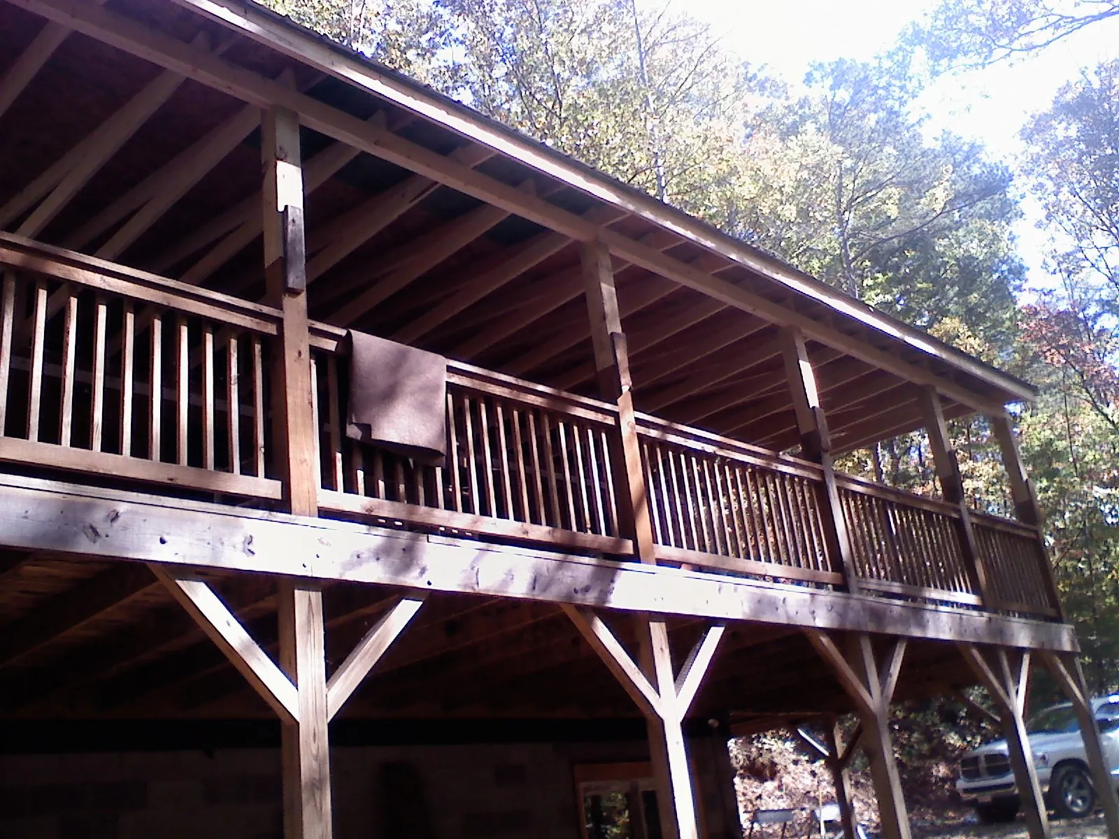 Timber framing under a new elevated porch and deck — Roof Leak Repair in Waterville Valley by Roofing Brothers